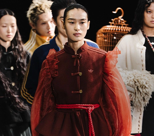 Female Model wearing an adidas jacket outdoors. (Photo)