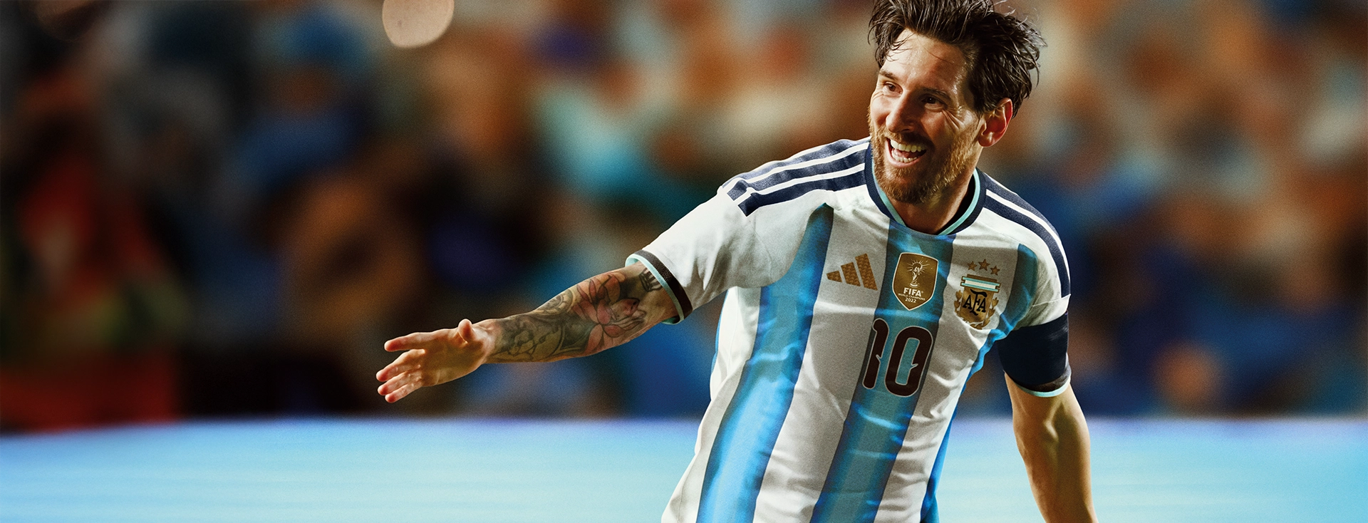 Lionel Messi in an Argentina adidas jersey celebrating in a stadium. (Photo)