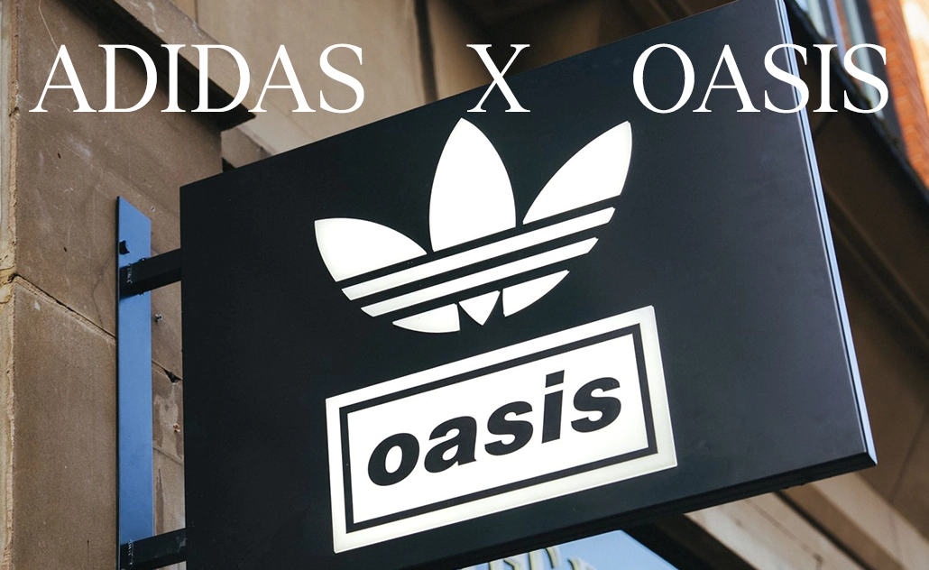 Black storefront sign with adidas Trefoil logo and “oasis” lettering. (Photo)